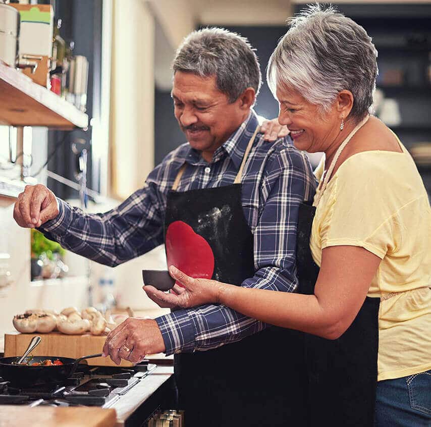 Older couple cooking together