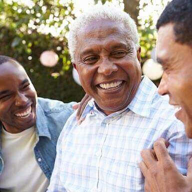 Father and sons smiling