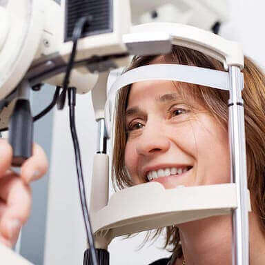 Woman getting eye exam